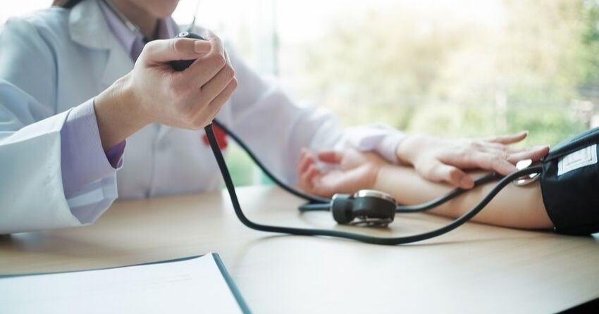 checking blood pressure hypertension