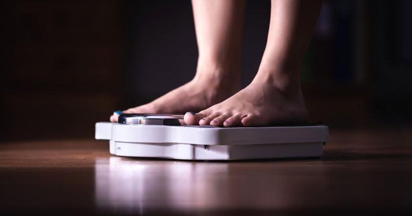 feet on scale, overweight