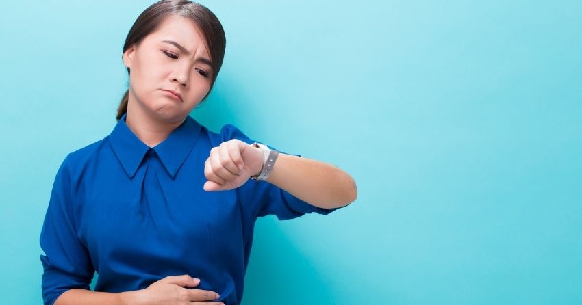 hungry woman looking at clock, Hunger Hormone Ghrelin Also Impacts Memory