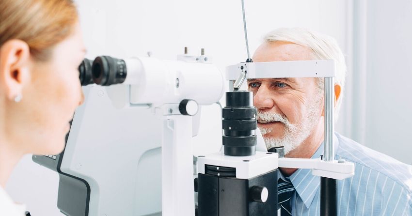 senior getting eye exam, retinal scan