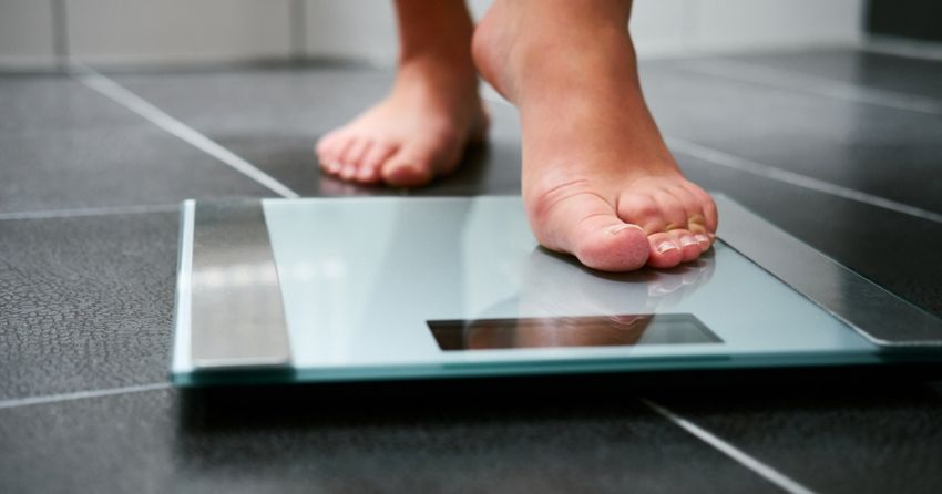 standing on scale weight overweight